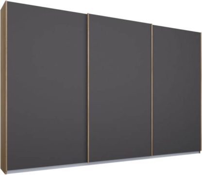 4d1d56fd827fed61ee468df96bb61be848f5e7777e85dfaffc859f4396088208.jpg An Image of Malix 3 door 270cm Sliding Wardrobe, Oak frame,Matt Graphite Grey doors, Standard Interior