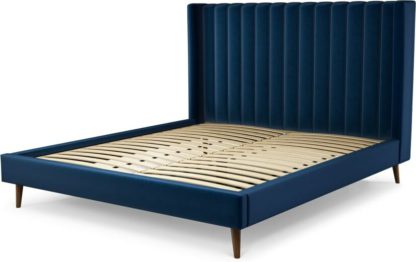 048deb2081c81b2d32d83e14687322fa19647a7b8edadfe4ff13894af2a58b71.jpg An Image of Custom MADE Cory Super King size Bed, Regal Blue Velvet with Walnut Stained Oak Legs