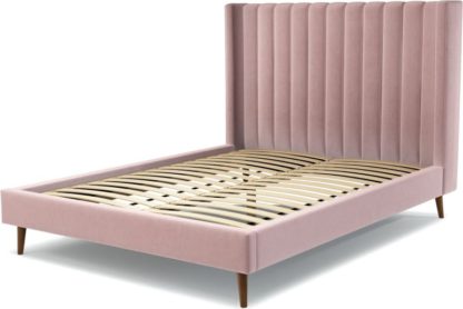 d3d76eefdbba2b74ac167ca65a4efe588d5185cbd0da239d7e185159cb9f8770.jpg An Image of Custom MADE Cory King size Bed, Heather Pink Velvet with Walnut Stained Oak Legs