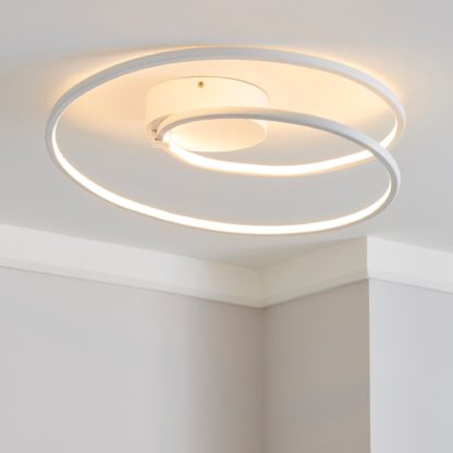 0274c113ac2f21e9c64e3051ab33aa53cec6c014e484e43f12017ab756f4f3ff-1.jpg An Image of Menton Integrated LED Swirl White Semi-Flush Ceiling Fitting White
