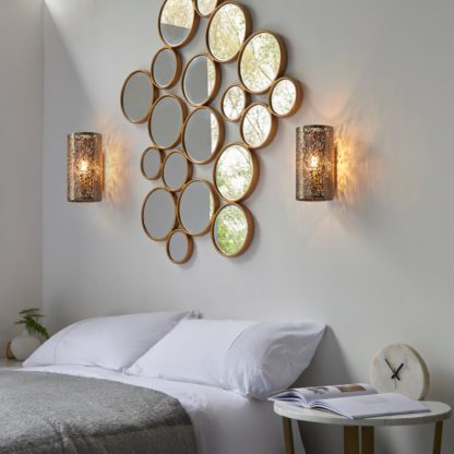 0ba970a2384744f045562e0fc01a6fdb9044ec67769c4a4f1a01b6cce9395b54-1.jpg An Image of Endon Secret Floral Wall Light Antique Brass