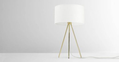 1b369c584c6605591861340f56b14436c356438723f7064c7c0fcf4f87b343c6.jpg An Image of Frances Tripod Table Lamp, Brass
