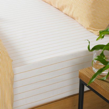 20d836fb63f068afa405f47fd40aae9bbbe7663059f6f316a02d72686320de49-1.jpg An Image of Holbury Ochre Stripe 100% Cotton Fitted Sheet Yellow and White