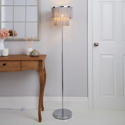 4f98bbb2a109e823eea1cf5378f32fdbefe383d5dd8736467d38db0bdef102c3-1.jpg An Image of Jaz Fringe Grey Floor Lamp Grey