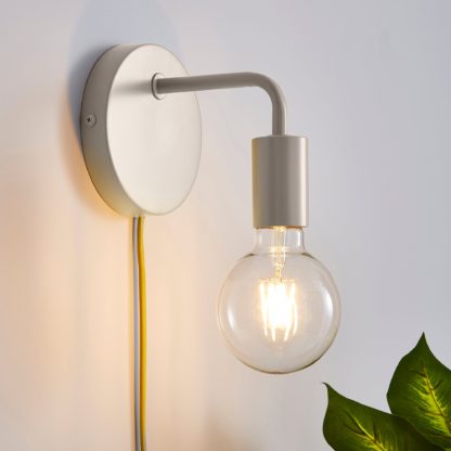 5ab7256df04f27446d148a4bd8b6c464122597e284ca3f6682afebb5c2206a51-1.jpg An Image of Grey Koppla Plug-in Wall Light Black