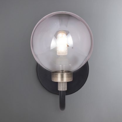 615d2f4ea18f76f64cdd0a3e436e917d1dd6cbb99cff4c1dbdb6bba0e5b572fa-1.jpg An Image of Tanner Black Wall Light Black