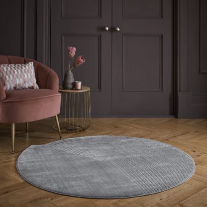 940cae4724adc94b3d5ec4153f1e839f17979ccffb8f5d4b98e64f696061dea4-1.jpg An Image of Noah Shaped Dia 133cm Circle Rug Grey