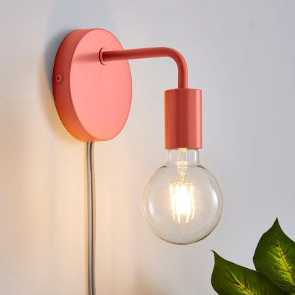 a8f14b76e05b119ceca5ae445418eba3f3afb21aa3fe5df8ee0c8a8df30c2855-1.jpg An Image of Pink Koppla Plug-in Wall Light Black