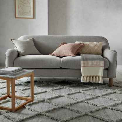 decc83773e9d07da5cc8ea51a36de7a114898a1b6ec0cea0db8fb2440579764e-1.jpg An Image of Thea Fringe Rug Thea Silver
