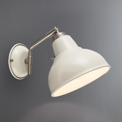 e9d26367147f4b2293aae763f7242703549c66aa8e3fec44fc414e6a284bf68a-1.jpg An Image of Bradwell Ivory Wall Light Cream