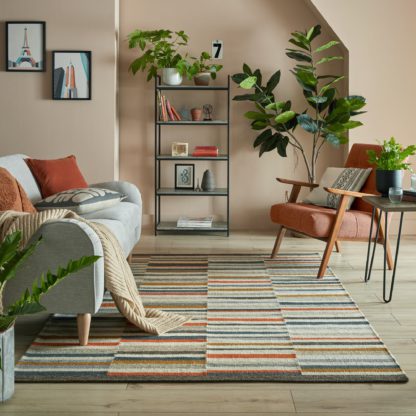 f28b3db0235a4bedf107e86d6cbdd8f532a86ec4d98e15f608c65efa1491a652-1.jpg An Image of Drake Stripe Woven Rug Blue, Yellow and Orange