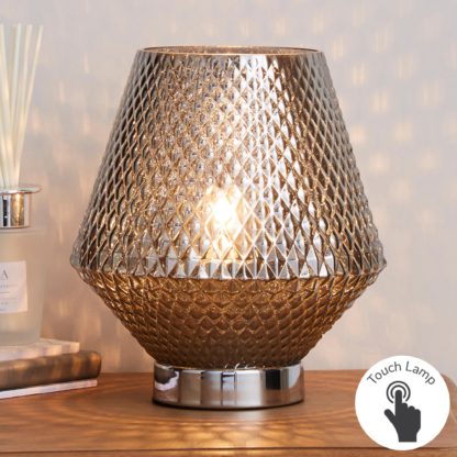 1fc8fccf1125ad95317907f2fa0550893e2d7747174f069c35b223df600fceba.jpg An Image of Miah Smoked Glass Touch Dimmable Table Lamp Silver
