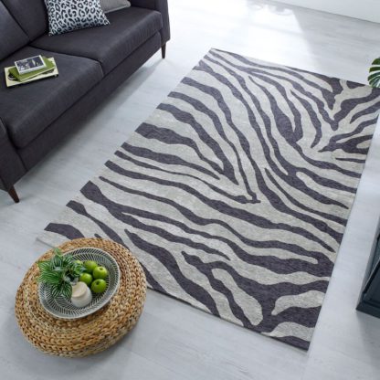 2af96dbe0b46b3531c09be0bb2b5a128acce2d45072ed72cbb75aaec6084eb65.jpg An Image of Wilder Zebra Rug Black, White and Yellow