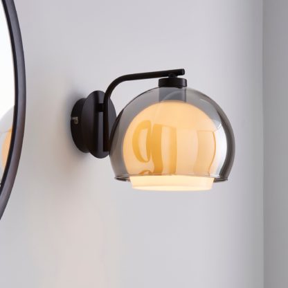 5732b957298fd045b3ab89d3baf699ed4ed56a4234f38fda72fb279b0476fabf.jpg An Image of Elements Ramona Glass Wall Light Chrome