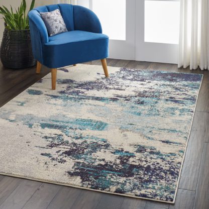 a947ca4a55eb151aaa1720b346bcad65a917a0715f85b02dae31cfc5ce9513d4.jpg An Image of Teal Celestial Rug Teal