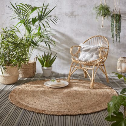 b7d20fbf55be95ca65aaa919f854b49d81d79333ec38addf4073c91af97fb472.jpg An Image of Eta Jute Circle Rug Natural (Brown)