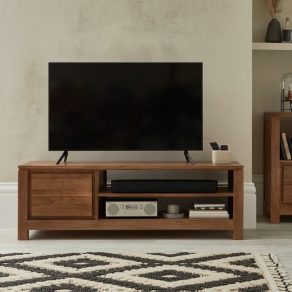 cd697d3e2ba5f9eea6dc909d0c14fbdd1ab076ff96bb9bd037456ee81468a444.jpg An Image of Harlam Wide TV Stand Brown