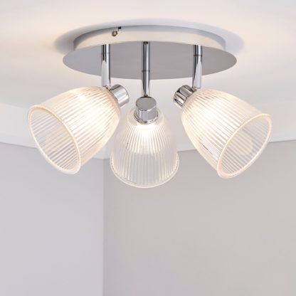 da909e77ff6e2de8597992eb9deb27d74e90d32ff39163e355fe7c58fcb38b3b.jpg An Image of Bremont 3 Light Ribbed Glass Bathroom Spotlight Clear, Chrome