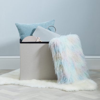 de00197ec6527d9e34007a4bea7ffbcb3a05fba28055f0ccd9c5c5520d17f87e.jpg An Image of Pastel Faux Fur Foldable Cube Ottoman Pink