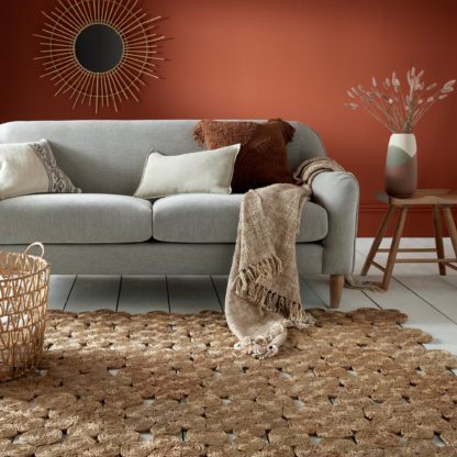 fc79078dc5caf6c53e753a158691f52ab61603bc9de1ca38a109cbcc94bc7a57.jpg An Image of Swirl Handmade Jute Rug Brown