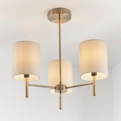 b78e6d4f4d9b0a8b230262d30777b1970e8ee52daee403bcfe8b494897df8c96.jpg An Image of Dewey Antique Brass 3 Light Flush Ceiling Fitting Antique Brass