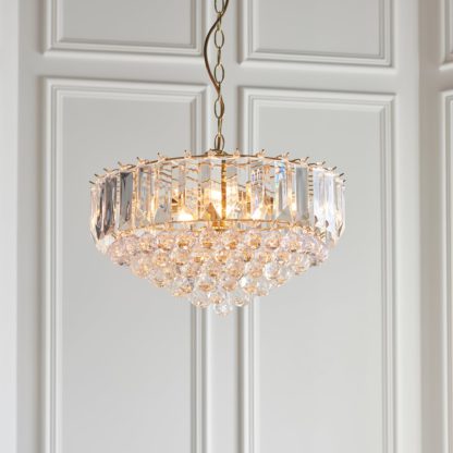 1890f242db69d277df4d6859542de304737644d7f21e0603126cc130e6f64dea.jpg An Image of Vogue Tioga Gold 6 Light Pendant Fitting Brass