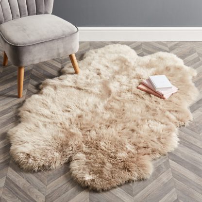 8a4a2f46c16a9fb3d6fa54adbe37ed2f9208dac9bf32daaf4caec71c703eb1f7.jpg An Image of Quad Sheepskin Rug Pink