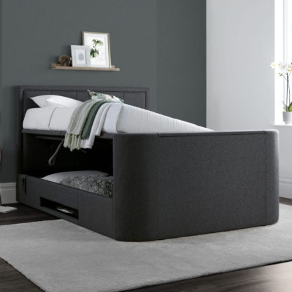 2a0c863c5e4e98e50c018b591cbc9800e2c434255c23b804b75554f667698432-1.jpg An Image of Eston Grey Fabric Ottoman Electric Media TV Bed Frame - 6ft Super King Size