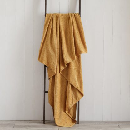a3f4bd37730e9626b7f68dda6f42c9277e87cee05d3b8ec99860f7edd31020cc.jpg An Image of Chenille Ochre Throw Yellow