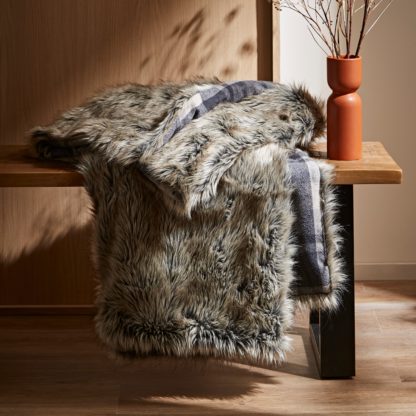 c73f978988c2f6255dd177f1232492966283cb66a3408018882d85f861fc6b09.jpg An Image of Alpine Check Faux Fur Throw Brown