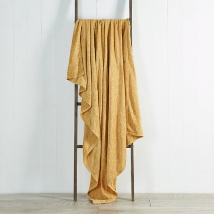 d0e9e67daa25afa49baa1b1f8cfc5f3bf8b37b083557487ad0255c47264b3344.jpg An Image of Chenille Ochre Throw Yellow