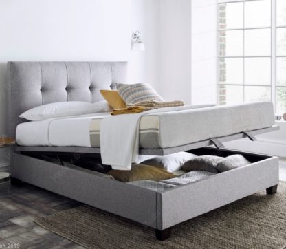 22df38ff143764a072eb5bb8fed17046f32190497e43f42b6547799881b073cf.jpg An Image of Walkworth Light Grey Fabric Ottoman Storage Bed Frame - 6ft Super King Size
