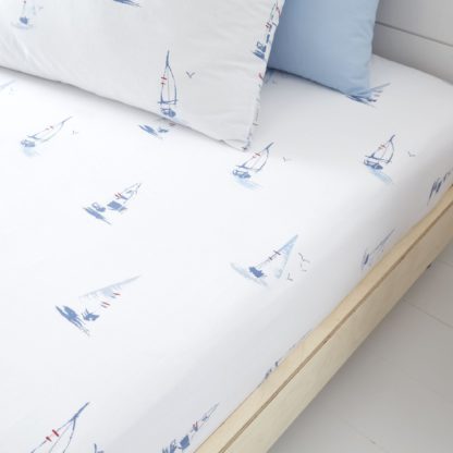 6b968cf3007149708c46741c4c3521a8470a0965791be141f21a0f54df85af72.jpg An Image of Bianca Fine Linens Sailing Boats 100% Cotton Fitted Sheet Blue
