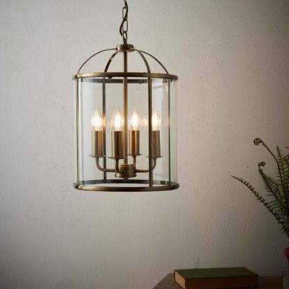 96c457bfa77da02060950b95b14930bd2887c2604ae1330cadf8cfb47136ac46.jpg An Image of Vogue Lambeth 4 Light Pendant Ceiling Fitting Brass