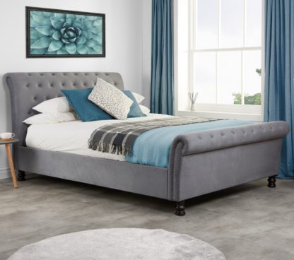 22c8c7821d30f0be04a1ffdb9bd20f9b67a03089545a8cf73680cd86b40561bb.jpg An Image of Opulence Grey Velvet Fabric Scroll Sleigh Bed Frame - 4ft6 Double