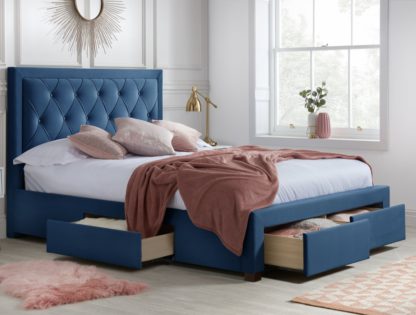 f627dd1a7a275383a9b923688554de26809393686dd773f122e04eed5e7d24a5.jpg An Image of Woodbury Blue Velvet Fabric 4 Drawer Storage Bed Frame - 4ft6 Double