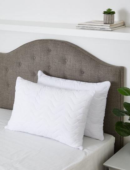 3e640a28c1a908a8341fc7bbe5ffe264b2723c1787a24db55fd0dfc57e654bec.jpg An Image of M&S 2 Pack Soft As Down Medium Pillows