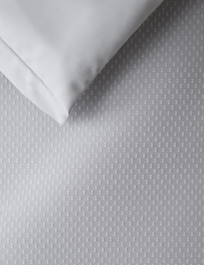 4be3eac19f3030397af2826a2cb9bf20406d142ea23e62a481c2aa33a2d0d6e9.jpg An Image of M&S Iris Pure Cotton Spotty Dobby Bedding Set