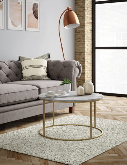 728ece31907cee516d135696c9e4a2096dede751b8379060886f3143e9b20556.jpg An Image of M&S Farley Round Coffee Table