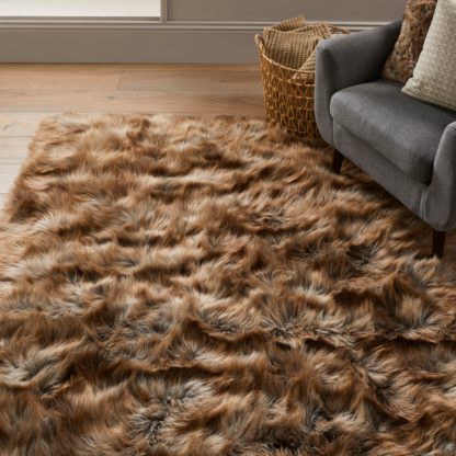 aa5701d4be8d12da1d0a7f998c03d3b9ff3d1c91c786672c50c847e793f38acf.jpg An Image of Siberia Faux Sheepskin Rug Siberia Brown