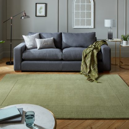 4a9ad2b204c42eada69915104b9bf90249d673ef6d6883e7a328b2b43ddd804d-1.jpg An Image of Boston Wool Border Rug Blush