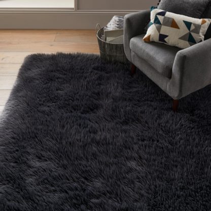 5d4bdc1dfc306168172eac1a7a1461cca204b5b537698779897bafad005c3d7b.jpg An Image of Luxe Faux Sheepskin Rug Luxe Ivory