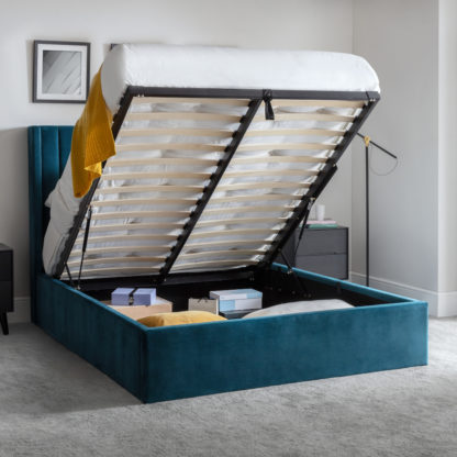36d13c22ac2ecace4965fd5c2eda6c9656a397aa9c0f86752ccf05e97c067434.jpg An Image of Langham Teal Velvet Ottoman Storage Bed Frame - 4ft6 Double