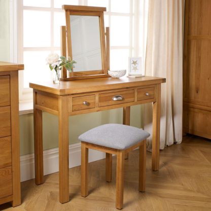 9de3020aec6cdf151a8f67c3d32d5610c88b11ed1dadeec224e38fce7dbad58b.jpg An Image of Woburn Oak Wooden 3 Drawer Dressing Table
