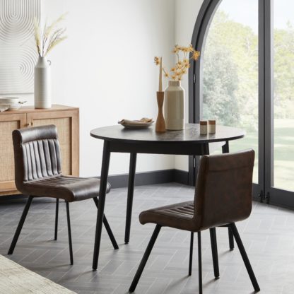 3583cb1311f0b32f3a24ea62d09272bf59b587af20eff79634d8ef7dc1d97dbf.jpg An Image of Felix Set of 2 PU Leather Dining Chairs Brown