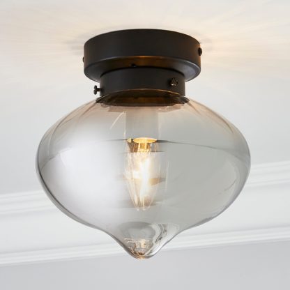 91a36700548be2b2d224ead4fd198b80a92202911dd9e3dea669c9c9bac362e6.jpg An Image of Voyager 1 Light Smoked Flush Ceiling Fitting Matt Black