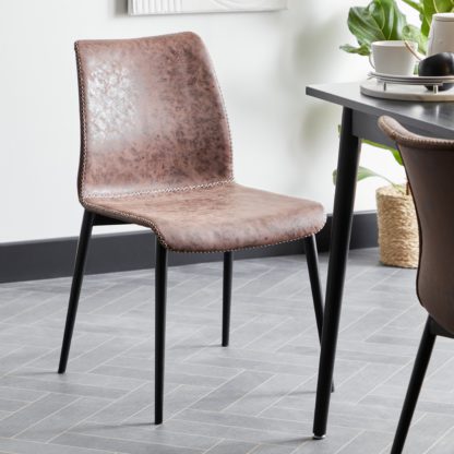 a4eb7ec0bcc617549b312c2bcf7c83743c65e8236cb2504339c52e905a8c407f.jpg An Image of Venice PU Dining Chair Black