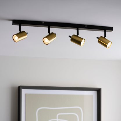 ffc6055d406a6cb5b762225925af6467a96ae18d7592b20a77dd75bf4b25da58.jpg An Image of Carter 4 Light Gold Spotlight Bar Gold