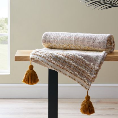 5cbd6d97f54a2efe8642dd9e97cd2fdf755472c689761d4c619f2f1205aaacb2.jpg An Image of Pretty Tufted Tassel Ochre Throw Ochre (Yellow)
