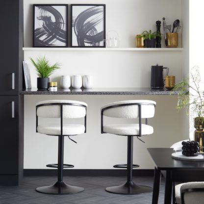 c6fdb3c4ba5df45396303d6068d949e0d505154d5f3804e5362d8aa610f71ea3.jpg An Image of Zena Boucle Swivel Bar Stool Black